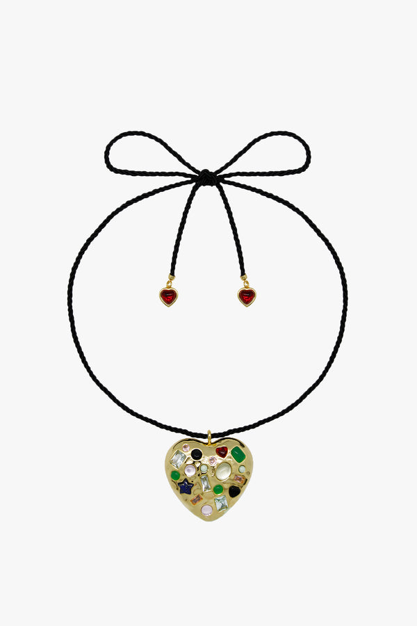 Gold heart necklace with gemstones on a black cord