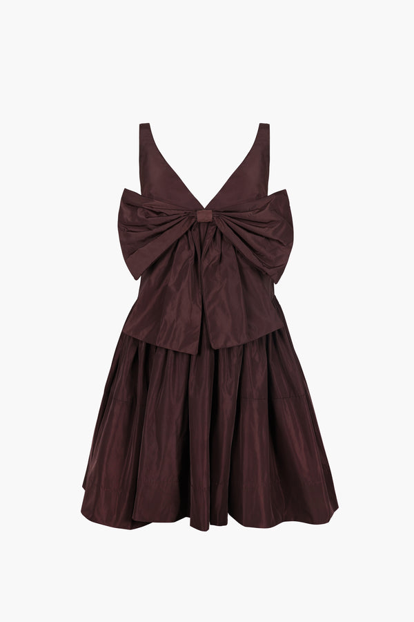 Mini dress in coffee brown taffeta with bow at front and cape in back