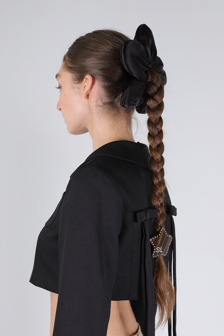 Black flower shaped hair scrunchie on model