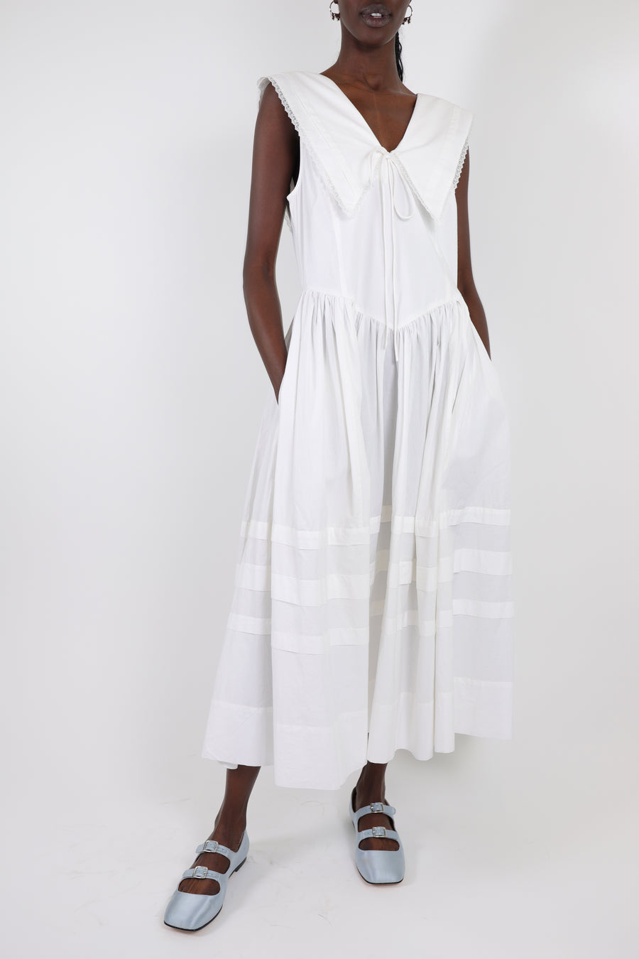 Sleeveless cotton midi dress in white with oversized collar on model