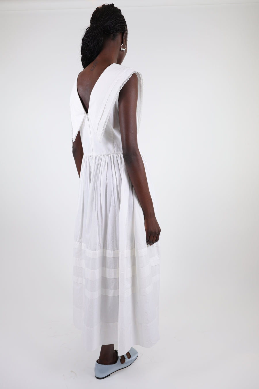 Sleeveless cotton midi dress in white with oversized collar on model