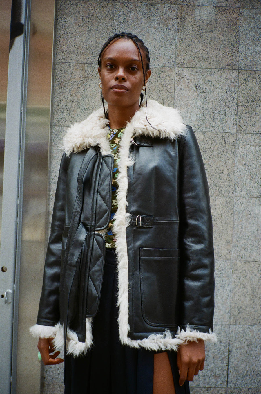 Reversible black nappa leather and cream shearling coat on model